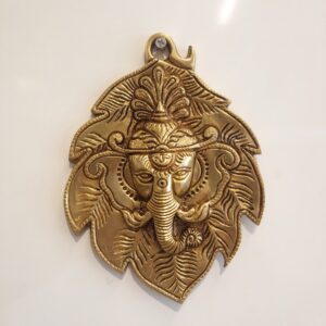 Brass Ganesha Face In Leaf Wall Hanging